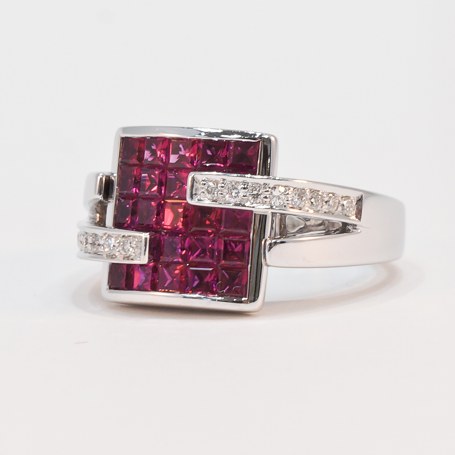 18K white gold invisible set ruby and diamond ring